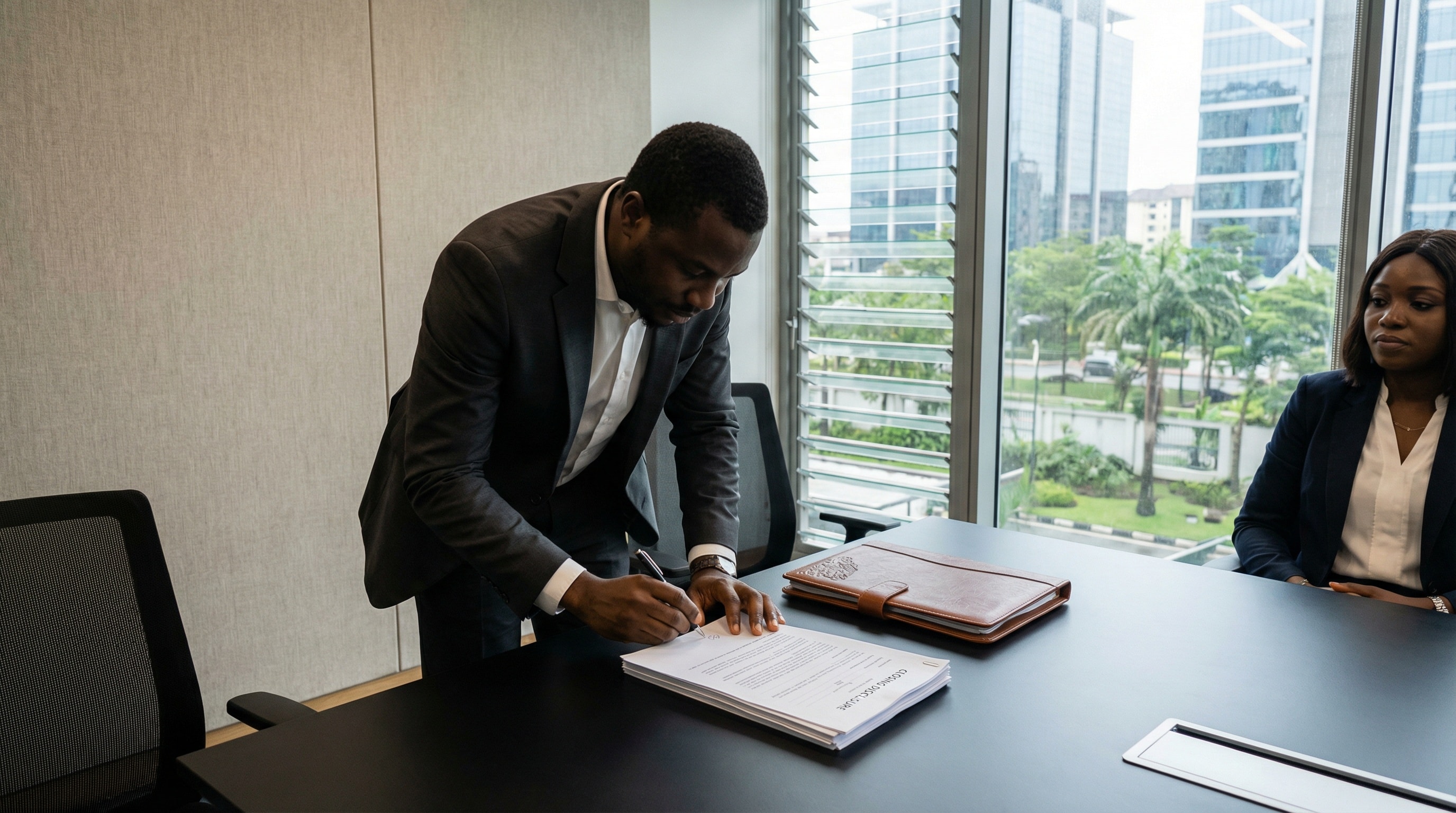 Closing cost calculator: professional at settlement or with closing documents, real estate transaction, natural light, local expertise and professional excellence.